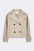 Beige Damen-Trenchcoat, doppelte Knopfleiste, klassischer Kragen, modisch, vielseitig, ideal für Herbst und Frühling, zeitloser Stil.