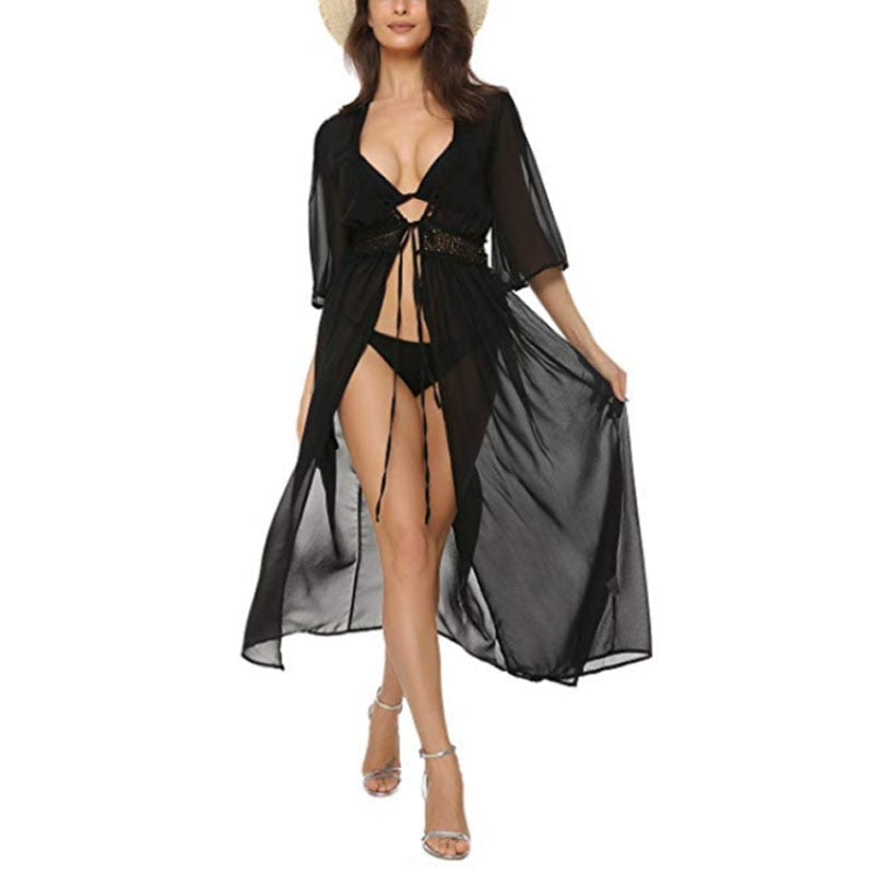 Schwarzer Strandkimono für Damen, transparent und luftig, ideal als Bikini-Cover-Up. Perfekt für Sommer, Strandmode und Urlaub.