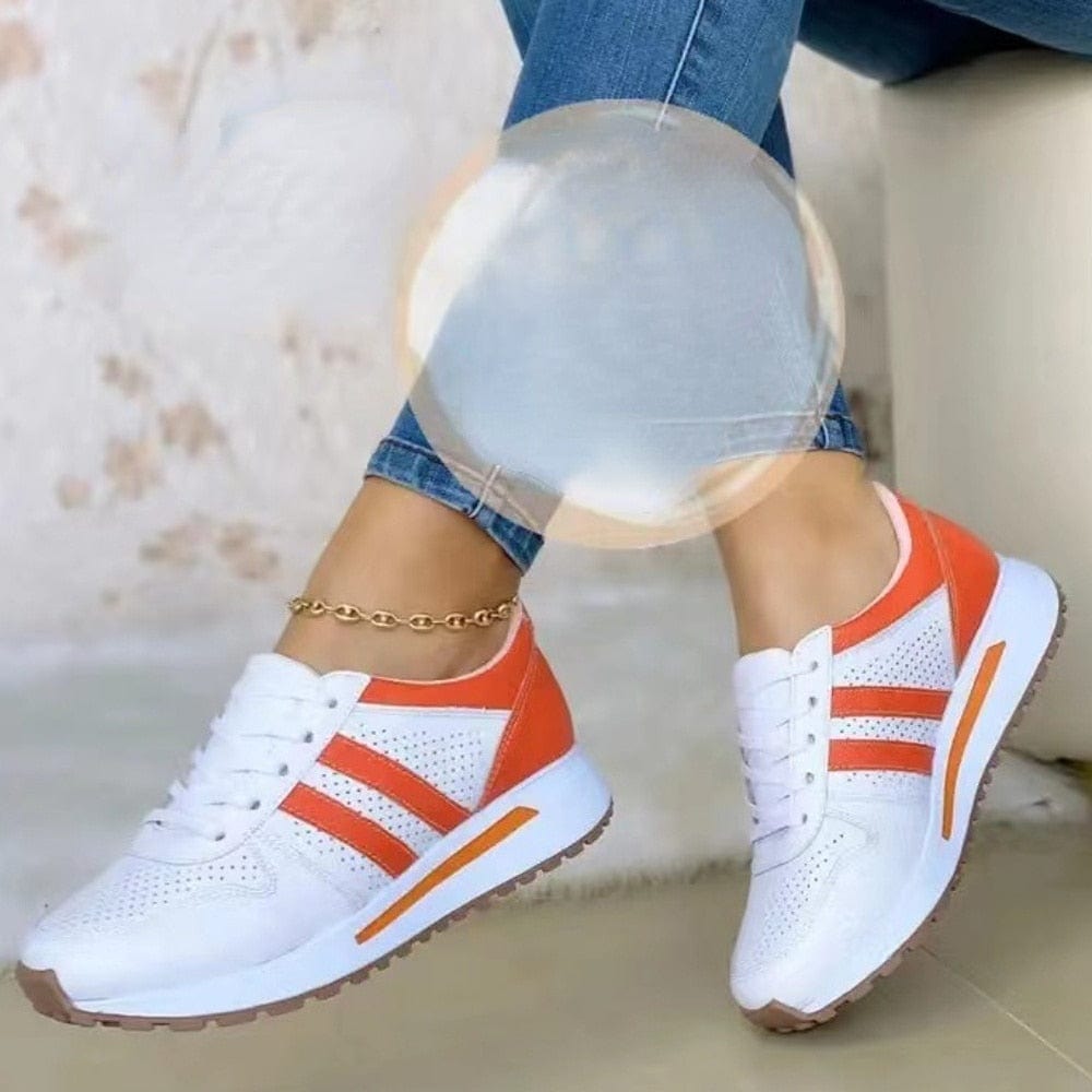 Damen-Sneaker in Weiß und Orange, sportlich und modisch, mit bequemer Sohle. Perfekt für Freizeit und Sport. Trendige Turnschuhe für Damen.